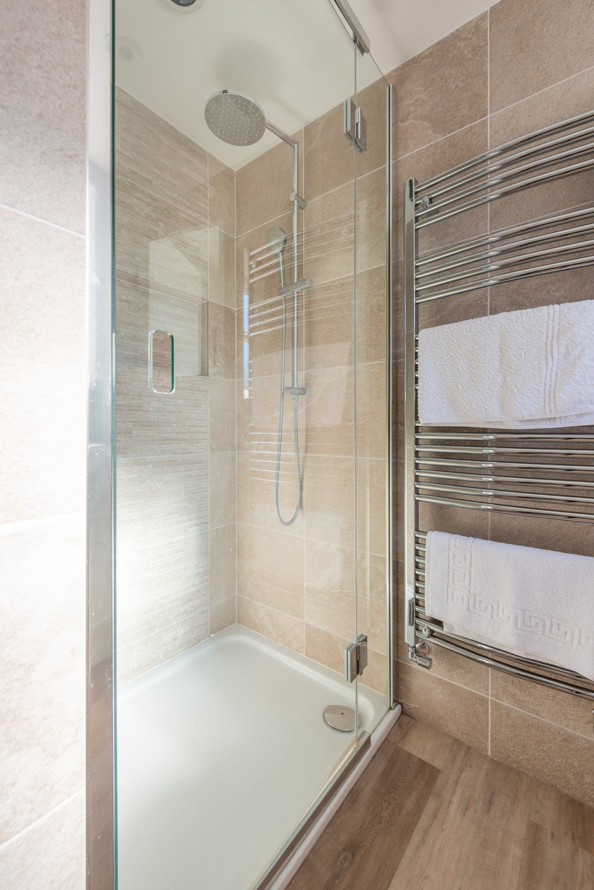 Shower room with a glass enclosure and rainfall shower