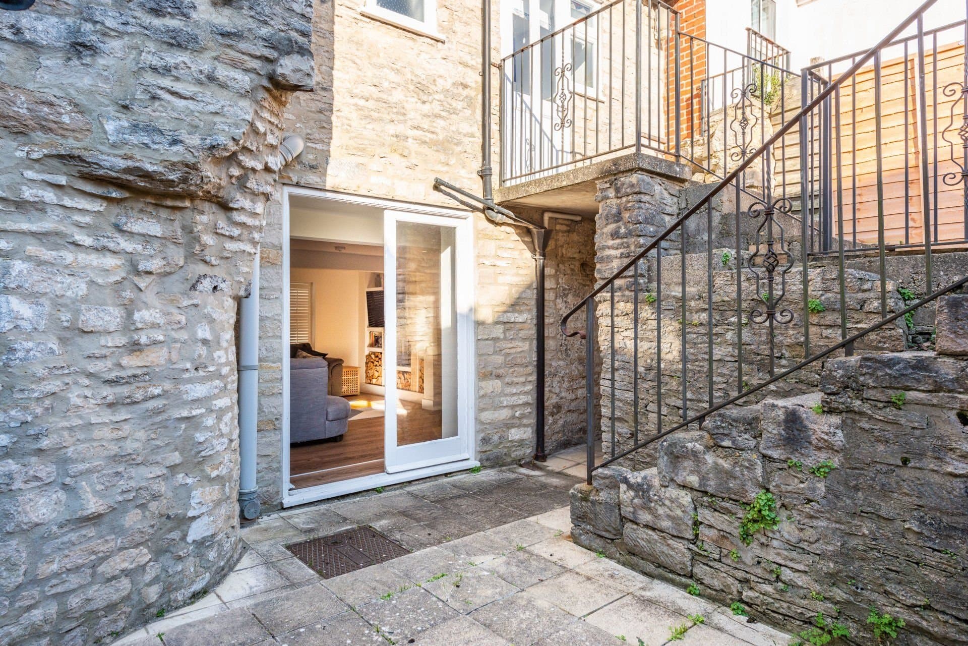 Patio doors onto the stone terrace, looking back into the sitting area