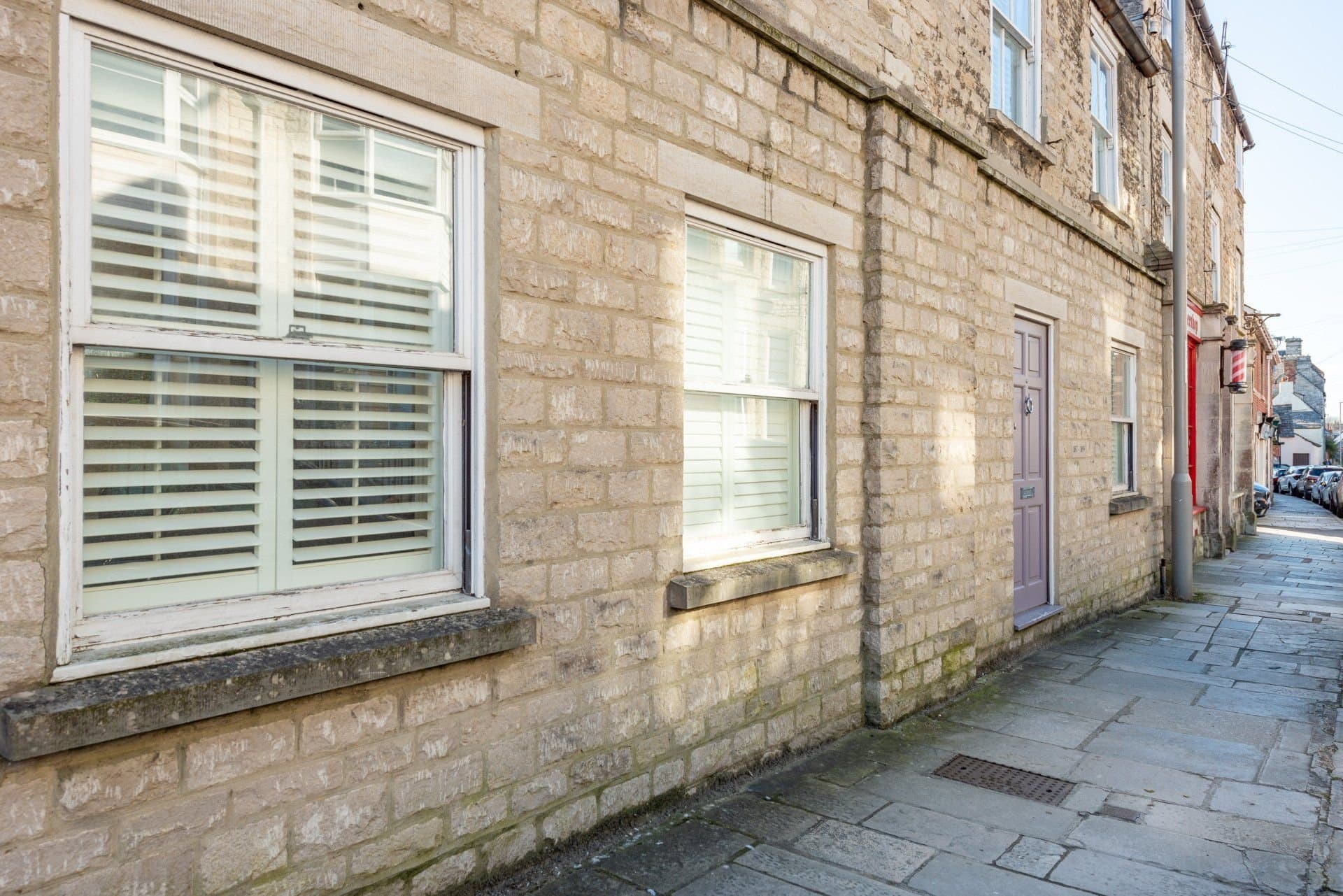 Stone facade and front door of the cottage in Swanage