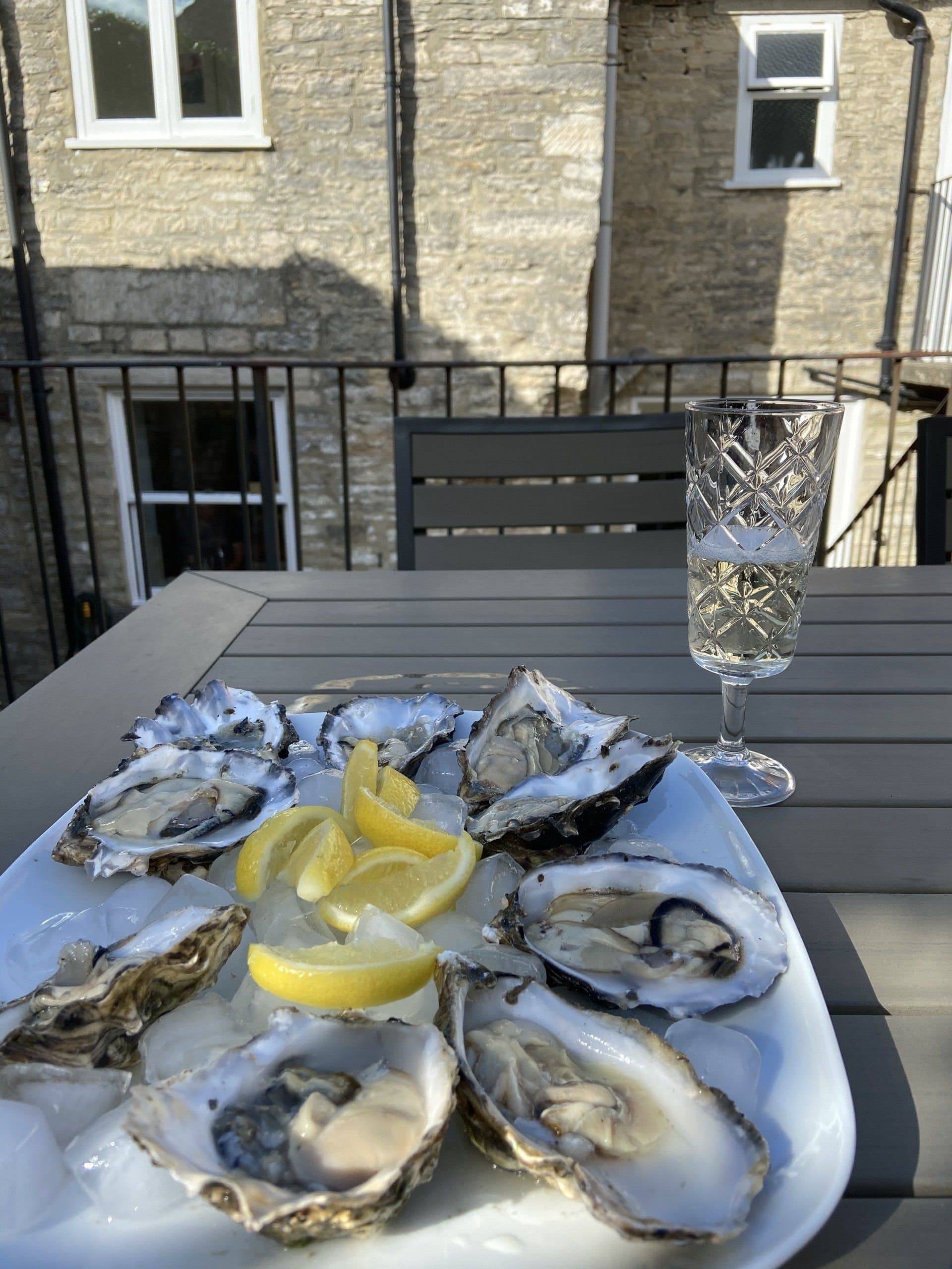 Outdoor table on the patio, set for a drink in the sun